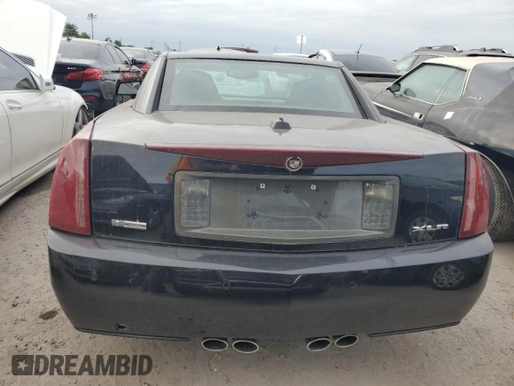 2005 Cadillac XLR z VIN 1G6YV34A955600425, wystawiony jako Copart lot #76188034 z przebiegiem Nie podano mil oraz Szkody całkowita. Historia ofert i sprzedaży dostępna na DreamBid. Obrazek 6.