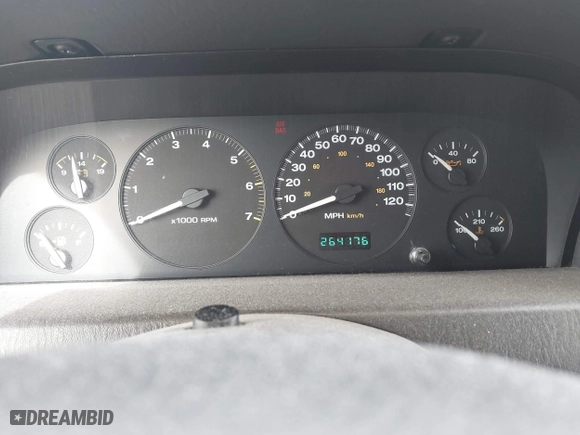 1999 Jeep Grand Cherokee Laredo with VIN 1J4GW58S6XC613307, listed as a IAAI auction lot 41592687 with 264,176 mi miles. Bid and sale history available at carsss.com. Image 7.