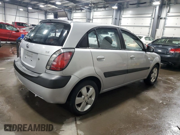 2009 Kia Rio LX with VIN KNADE243196496923, listed as a Copart auction lot 44235725 with 103,171 mi miles and Salvage Title. Bid and sale history available at carsss.com. Image 3.