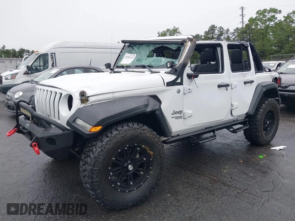 2018 Jeep Wrangler Unlimited Sport with VIN 1C4HJXDG0JW233696, listed as a IAAI auction lot 42523474 with 66,961 mi miles and . Bid and sale history available at DreamBid. Image 2.