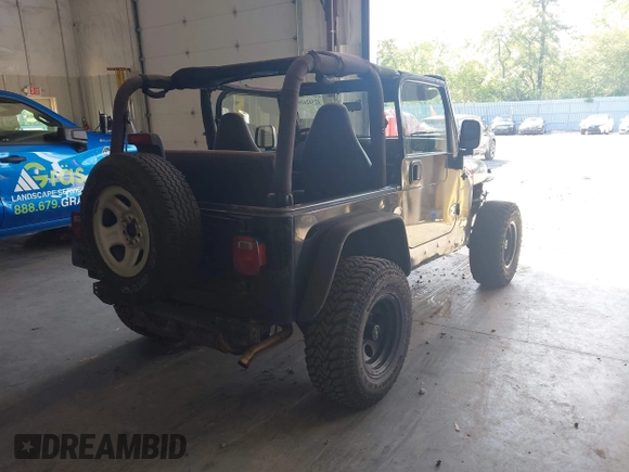 1999 Jeep Wrangler Sport with VIN 1J4FY19S4XP494405, listed as a IAAI auction lot 42542416 with 168,856 mi miles and . Bid and sale history available at DreamBid. Image 4.