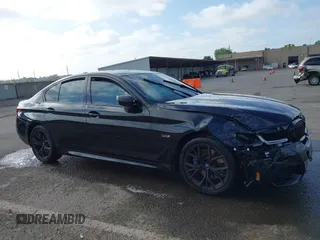 2023 BMW 5 Series 530e with VIN WBA13AG09PCL56556, listed as a IAAI auction lot 42098427 with Not provided miles and . Bid and sale history available at DreamBid. Image 13.