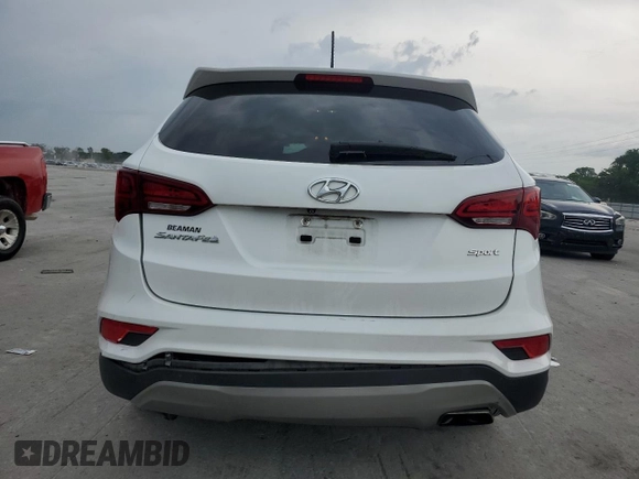 2018 Hyundai Santa Fe 2.4L with VIN 5NMZT3LB2JH056889, listed as a Copart auction lot 57801705 with 133,454 mi miles and Salvage title. Bid and sale history available at DreamBid. Image 6.