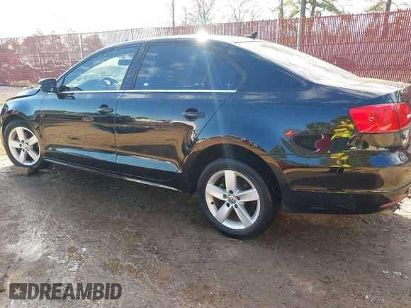 2012 Volkswagen Jetta TDI w/Premium with VIN 3VWLL7AJ2CM426050, listed as a IAAI auction lot 41332817 with 111,996 mi miles and . Bid and sale history available at DreamBid. Image 3.