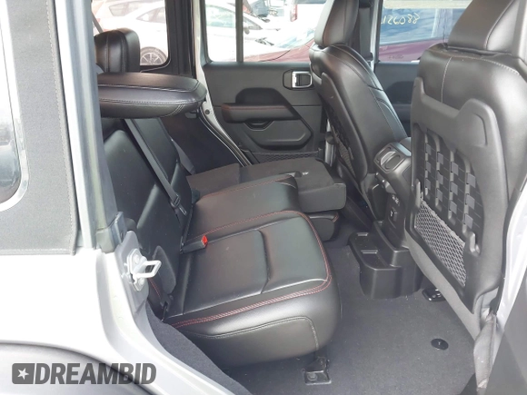 2021 Jeep Wrangler Unlimited Rubicon with VIN 1C4HJXFNXMW560512, listed as a IAAI auction lot 42124812 with 18,034 mi miles and . Bid and sale history available at DreamBid. Image 8.