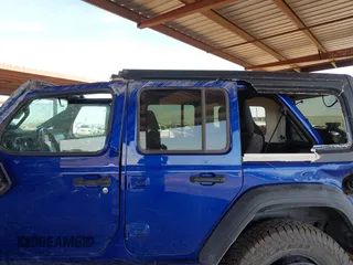 2020 Jeep Wrangler Unlimited Sport Altitude z VIN 1C4HJXDG4LW312551, wystawiony jako IAAI lot #41633675 z przebiegiem 60 097 mil mil oraz . Historia ofert i sprzedaży dostępna na DreamBid. Obrazek 6.