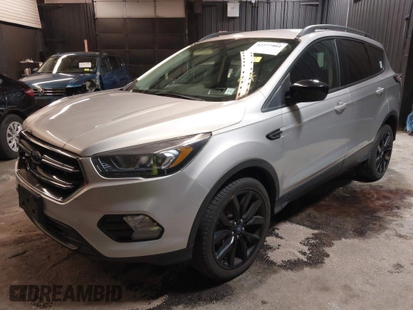2018 Ford Escape SE z VIN 1FMCU9GD0JUD33111, wystawiony jako IAAI lot #42277404 z przebiegiem 71 896 mil mil oraz . Historia ofert i sprzedaży dostępna na DreamBid. Obrazek 18.