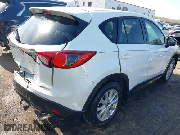 2014 Mazda CX-5 Touring with VIN JM3KE2CY5E0329783, listed as a IAAI auction lot 42017473 with 121,175 mi miles. Bid and sale history available at carsss.com. Image 4.