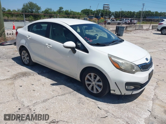 2013 Kia Rio SX with VIN KNADN4A33D6174454, listed as a IAAI auction lot 42032612 with 157,199 mi miles. Bid and sale history available at carsss.com. Image 1.