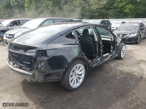 2022 Tesla Model 3 Long Range with VIN 5YJ3E1EB5NF288377, listed as a Copart auction lot 69836474 with 65,736 mi miles and Salvage Title. Bid and sale history available at carsss.com. Image 3.