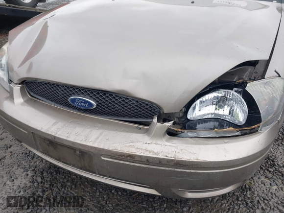2006 Ford Taurus SE z VIN 1FAFP53U26A197294, wystawiony jako IAAI lot #41506334 z przebiegiem 180 411 mil mil oraz . Historia ofert i sprzedaży dostępna na DreamBid. Obrazek 6.