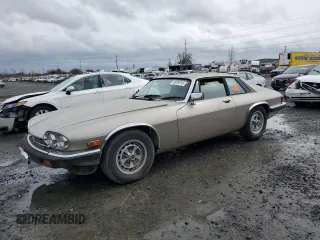1989 Jaguar XJS z VIN SAJNA5844KC150414, wystawiony jako Copart lot #49928915 z przebiegiem Nie podano mil oraz Tytuł czysty. Historia ofert i sprzedaży dostępna na DreamBid. Obrazek 1.