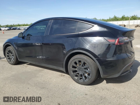 2024 Tesla Model Y with VIN 7SAYGDED0RF131495, listed as a Copart auction lot 56849765 with 10,120 mi miles and Salvage title. Bid and sale history available at DreamBid. Image 2.