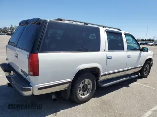 1999 Chevrolet Suburban with VIN 3GNEC16R0XG164600, listed as a Copart auction lot 49516445 with 105,747 mi miles and Salvage Title. Bid and sale history available at carsss.com. Image 3.