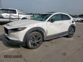 2021 Mazda CX-30 Premium Plus с VIN 3MVDMBEY6MM310185, выставлен на аукционе Copart как лот 63450555 с пробегом 24 903 миль миль и Списание • Salvage title. История ставок и продаж доступна на DreamBid. Изображение 1.