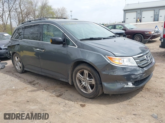 2012 Honda Odyssey Touring with VIN 5FNRL5H99CB028304, listed as a IAAI auction lot 42031916 with 216,185 mi miles and . Bid and sale history available at DreamBid. Image 1.