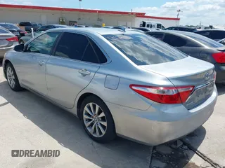 2015 Toyota Camry LE z VIN 4T1BD1FKXFU159875, wystawiony jako IAAI lot #42442875 z przebiegiem 97 545 mil mil oraz . Historia ofert i sprzedaży dostępna na DreamBid. Obrazek 3.
