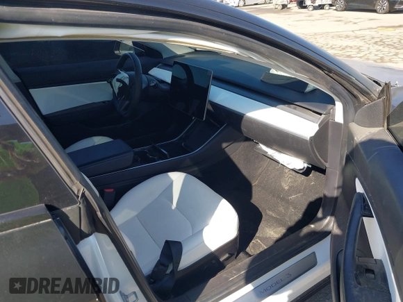 2019 Tesla Model 3 Mid Range with VIN 5YJ3E1EA0KF509547, listed as a IAAI auction lot 40720566 with 41,655 mi miles and . Bid and sale history available at DreamBid. Image 5.