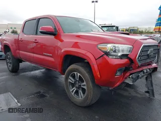 2018 Toyota Tacoma SR5 z VIN 3TMDZ5BNXJM038346, wystawiony jako IAAI lot #42164678 z przebiegiem 107 151 mil mil oraz . Historia ofert i sprzedaży dostępna na DreamBid. Obrazek 1.