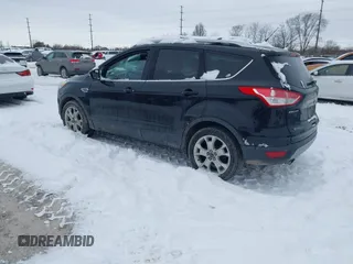 2016 Ford Escape Titanium with VIN 1FMCU9J96GUC08563, listed as a IAAI auction lot 41252475 with 120,404 mi miles. Bid and sale history available at carsss.com. Image 3.