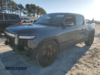 2023 Rivian R1T Adventure z VIN 7FCTGAAA1PN022134, wystawiony jako Copart lot #85545774 z przebiegiem 48 951 mil mil oraz Szkody całkowita. Historia ofert i sprzedaży dostępna na DreamBid. Obrazek 1.