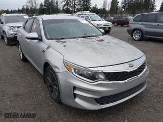 2016 Kia Optima LX with VIN 5XXGT4L31GG047355, listed as a IAAI auction lot 41657204 with 116,989 mi miles. Bid and sale history available at carsss.com. Image 1.