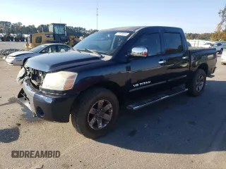 2006 Nissan Titan LE z VIN 1N6BA07B96N521997, wystawiony jako Copart lot #77970014 z przebiegiem 236 455 mil mil oraz Szkody całkowita. Historia ofert i sprzedaży dostępna na DreamBid. Obrazek 1.