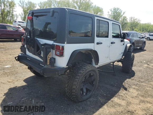 2013 Jeep Wrangler Unlimited Rubicon with VIN 1C4HJWFG2DL549064, listed as a Copart auction lot 56474055 with 148,217 mi miles and Salvage title. Bid and sale history available at DreamBid. Image 3.