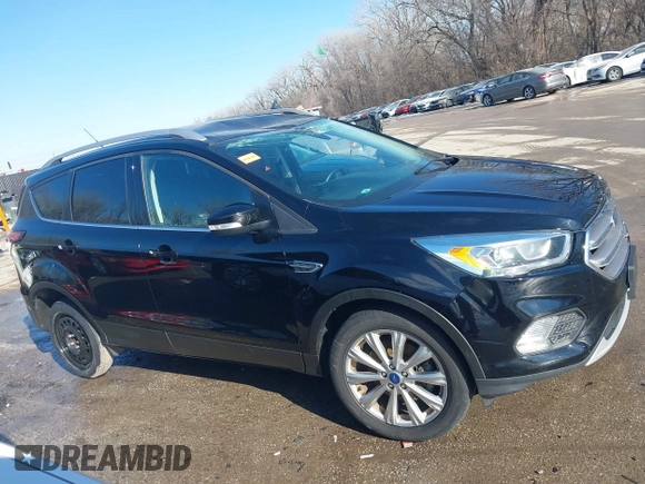 2017 Ford Escape Titanium with VIN 1FMCU0J94HUD58815, listed as a IAAI auction lot 41455415 with 80,421 mi miles and . Bid and sale history available at DreamBid. Image 14.