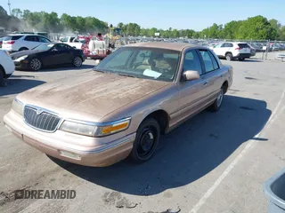 1996 Mercury Grand Marquis GS with VIN 2MELM74W3TX670994, listed as a IAAI auction lot 42052604 with 46,728 mi miles and . Bid and sale history available at DreamBid. Image 2.