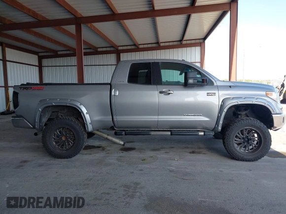 2015 Toyota Tundra Limited with VIN 5TFBW5F14FX424723, listed as a IAAI auction lot 42129929 with 222,060 mi miles and . Bid and sale history available at DreamBid. Image 13.