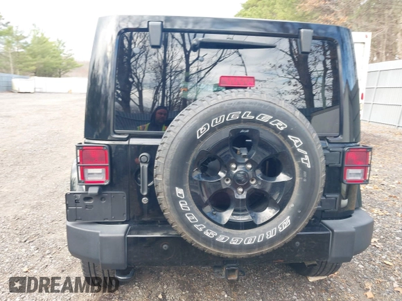 2015 Jeep Wrangler Unlimited Sahara with VIN 1C4HJWEG0FL661723, listed as a IAAI auction lot 41998393 with 89,077 mi miles. Bid and sale history available at carsss.com. Image 16.