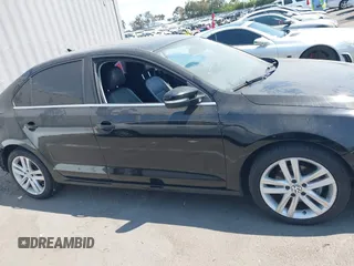 2015 Volkswagen Jetta SEL z VIN 3VWL17AJ7FM307632, wystawiony jako IAAI lot #42766536 z przebiegiem 101 661 mil mil oraz . Historia ofert i sprzedaży dostępna na DreamBid. Obrazek 13.