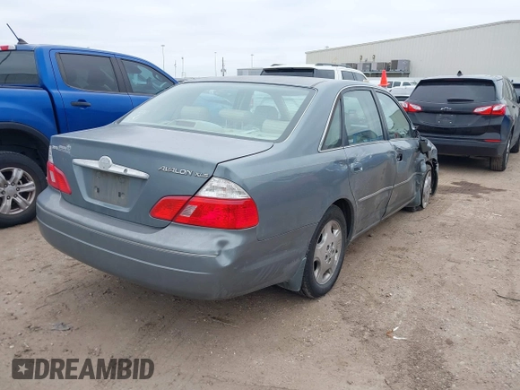 2004 Toyota Avalon XL with VIN 4T1BF28B84U370390, listed as a IAAI auction lot 41351151 with 242,910 mi miles and . Bid and sale history available at DreamBid. Image 4.