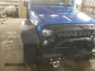 2015 Jeep Wrangler Willys Wheeler with VIN 1C4AJWAG2FL568130, listed as a Copart auction lot 80682914 with 111,686 mi miles and Salvage title. Bid and sale history available at DreamBid. Image 13.