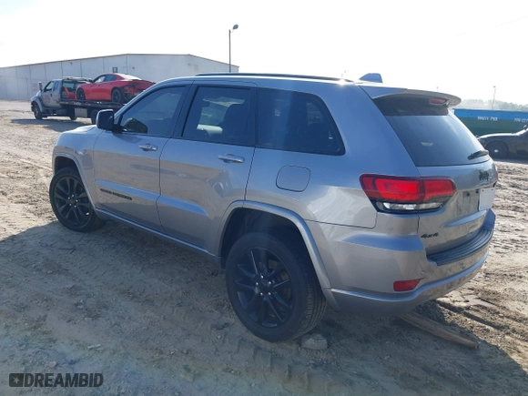 2018 Jeep Grand Cherokee Laredo E with VIN 1C4RJFAG0JC284927, listed as a IAAI auction lot 41964013 with 130,145 mi miles. Bid and sale history available at carsss.com. Image 3.