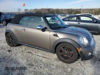 2011 MINI Convertible with VIN WMWZN3C53BT133576, listed as a Copart auction lot 87543835 with 69,999 mi miles and Salvage title. Bid and sale history available at DreamBid. Image 4.