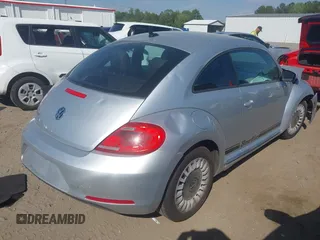2014 Volkswagen Beetle 2.5L w/Sun with VIN 3VWJP7AT7EM633386, listed as a IAAI auction lot 42060290 with 273,374 mi miles and . Bid and sale history available at DreamBid. Image 4.