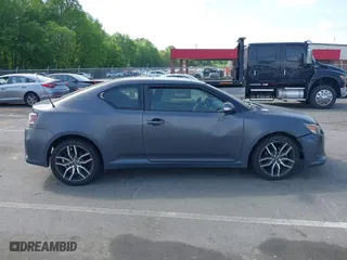 2015 Scion tC with VIN JTKJF5C71FJ013747, listed as a IAAI auction lot 42087740 with 138,097 mi miles. Bid and sale history available at carsss.com. Image 13.