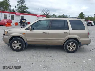 2006 Honda Pilot EX-L with VIN 5FNYF28566B010295, listed as a IAAI auction lot 41654433 with 302,539 mi miles. Bid and sale history available at carsss.com. Image 14.