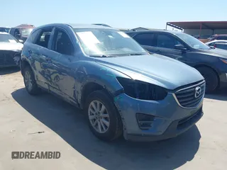 2016 Mazda CX-5 Touring z VIN JM3KE2CY2G0650652, wystawiony jako IAAI lot #42028361 z przebiegiem 192 113 mil mil oraz . Historia ofert i sprzedaży dostępna na DreamBid. Obrazek 1.