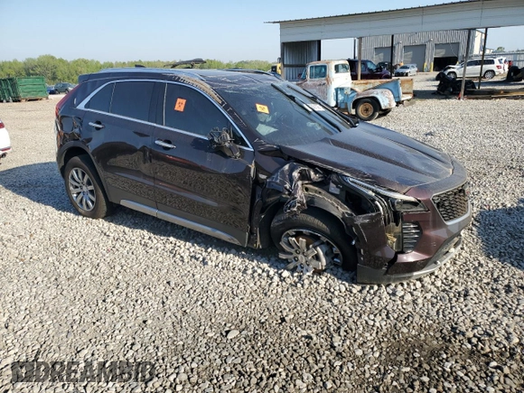 2021 Cadillac XT4 FWD Premium Luxury z VIN 1GYFZCR45MF002654, wystawiony jako Copart lot #52288105 z przebiegiem Nie podano mil oraz Szkody całkowita. Historia ofert i sprzedaży dostępna na DreamBid. Obrazek 4.