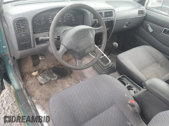 1996 Nissan Frontier XE with VIN 1N6SD16SXTC322219, listed as a Copart auction lot 49043685 with 102,964 mi miles and Salvage title. Bid and sale history available at DreamBid. Image 9.