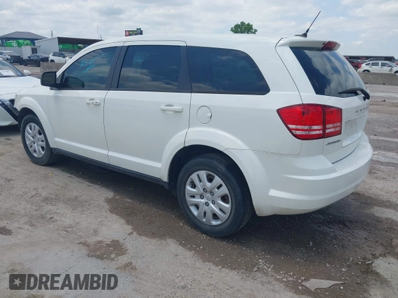 2013 Dodge Journey SE z VIN 3C4PDCAB1DT715883, wystawiony jako IAAI lot #42188089 z przebiegiem 111 905 mil mil oraz . Historia ofert i sprzedaży dostępna na DreamBid. Obrazek 3.