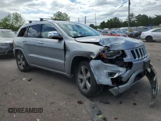 2015 Jeep Grand Cherokee Overland with VIN 1C4RJFCG3FC880084, listed as a Copart auction lot 57291165 with 112,442 mi miles and Salvage title. Bid and sale history available at DreamBid. Image 4.