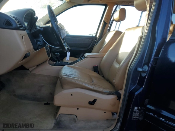 1999 Mercedes-Benz M-Class with VIN 4JGAB54E2XA106113, listed as a Copart auction lot 87996015 with 214,572 mi miles and Salvage Title. Bid and sale history available at carsss.com. Image 7.