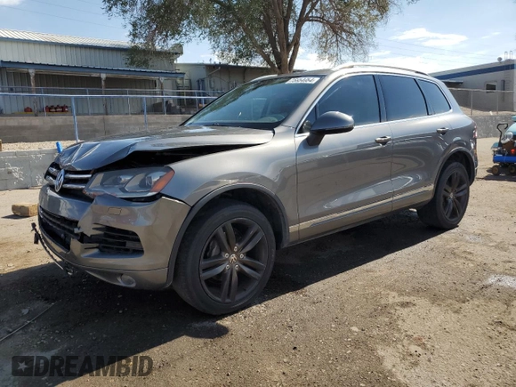 2013 Volkswagen Touareg Sport с VIN WVGEP9BP0DD010408, выставлен на аукционе Copart как лот 75854084 с пробегом 159 863 миль миль и Списание • Salvage title. История ставок и продаж доступна на DreamBid. Изображение 1.