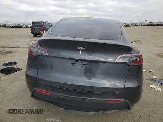 2025 Tesla Model Y Long Range with VIN 7SAYGDED6SF227475, listed as a Copart auction lot 42634345 with 3,493 mi miles and Salvage Title. Bid and sale history available at DreamBid. Image 6.