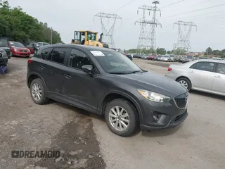 2014 Mazda CX-5 Touring z VIN JM3KE4CY2E0348500, wystawiony jako IAAI lot #42318155 z przebiegiem 182 616 mil mil oraz . Historia ofert i sprzedaży dostępna na DreamBid. Obrazek 1.