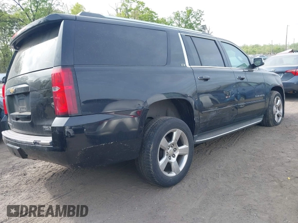 2015 Chevrolet Suburban LTZ with VIN 1GNSKKKC6FR637086, listed as a IAAI auction lot 42104826 with 79,986 mi miles and . Bid and sale history available at DreamBid. Image 4.